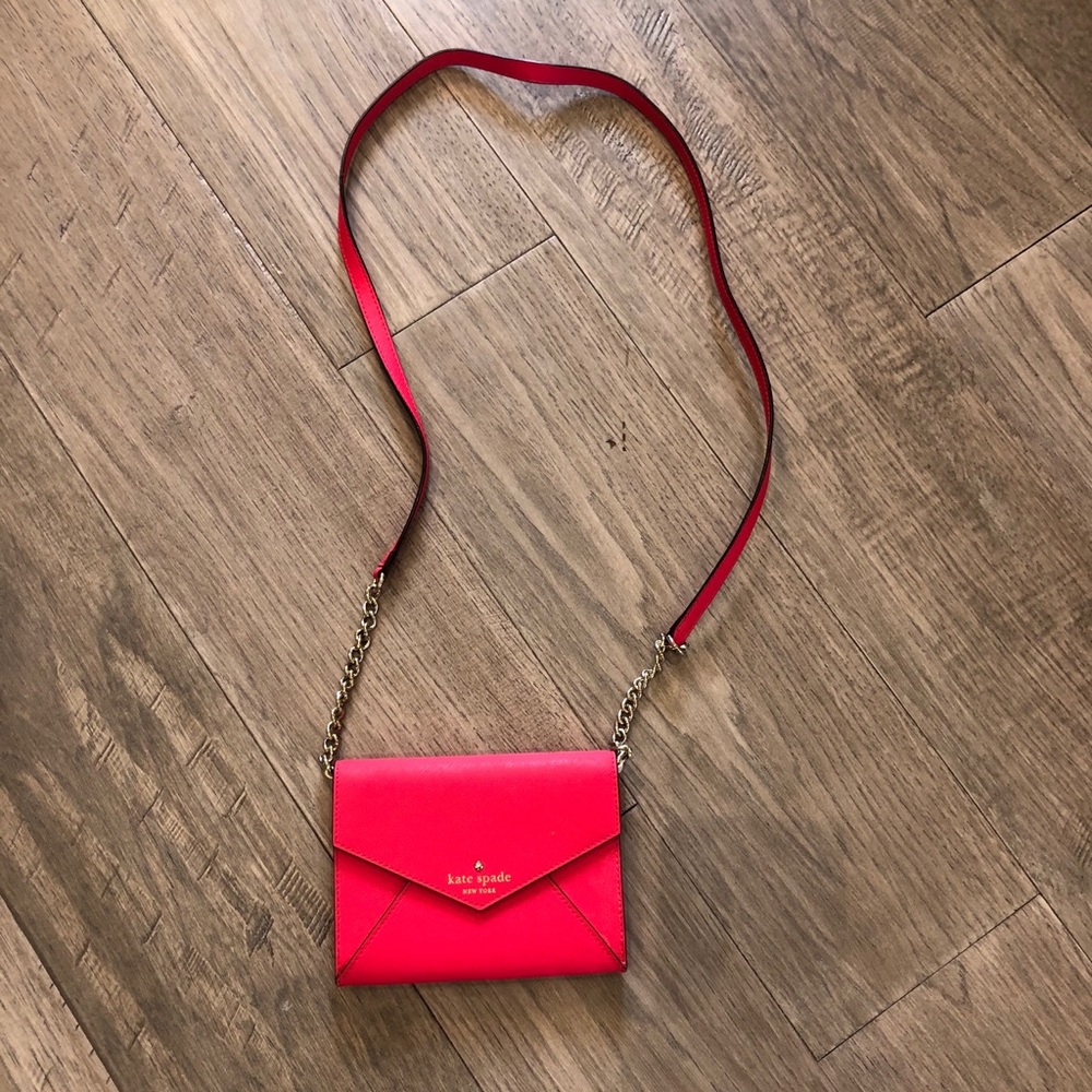 Neon pink Kate Spade envelope crossbody purse